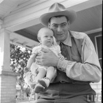Al Tomaini and Baby on Porch from Life Magazine Article